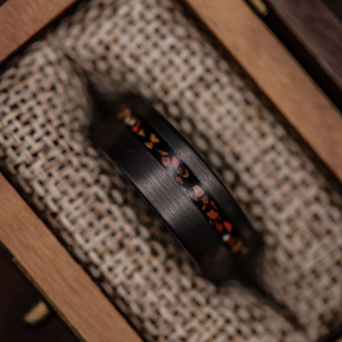 Silver wedding ring with intricate T-Rex bone detail, ideal for dinosaur lovers.