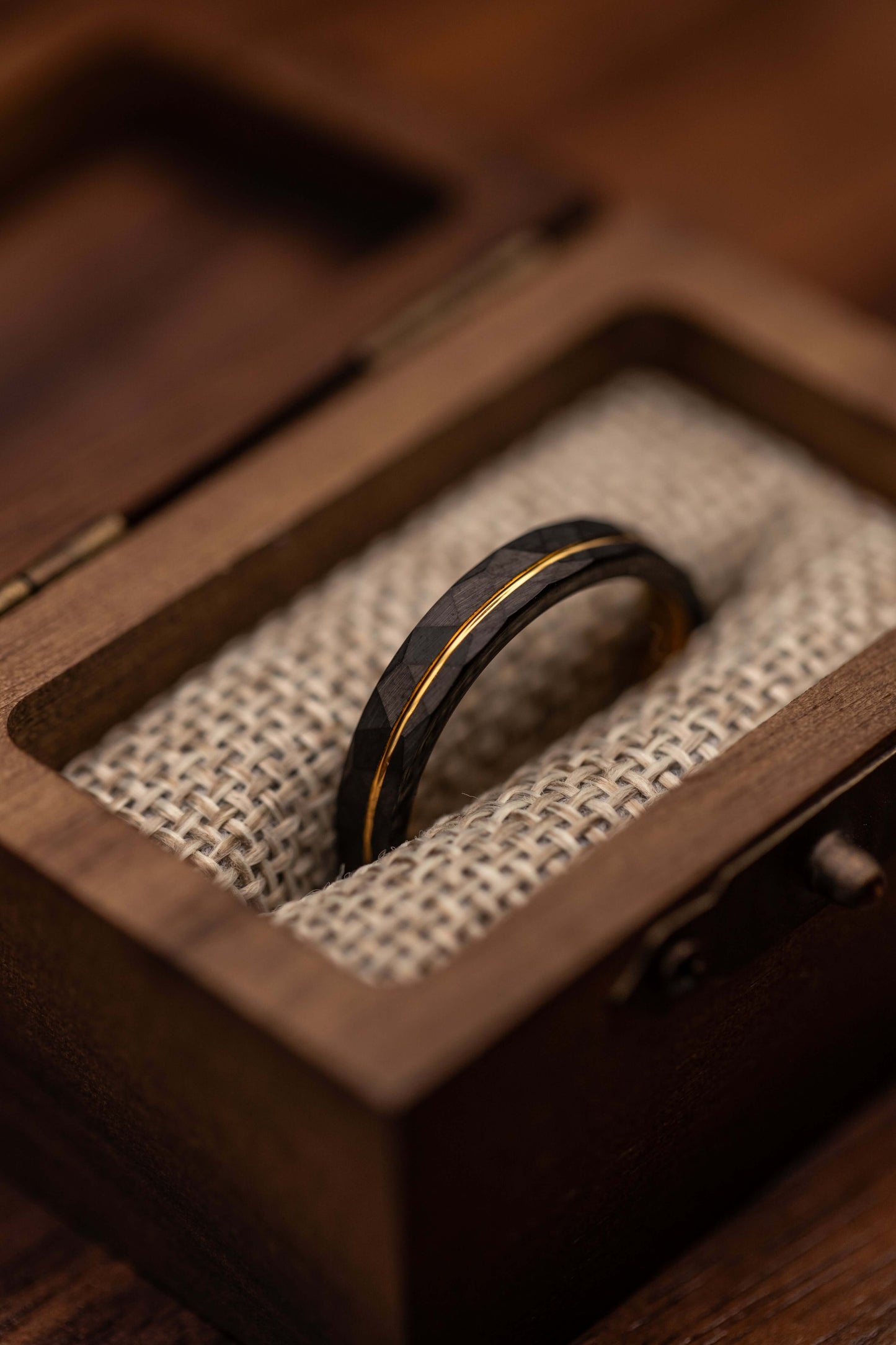 Elegant black and gold wedding ring, handcrafted for a distinctive and stylish look