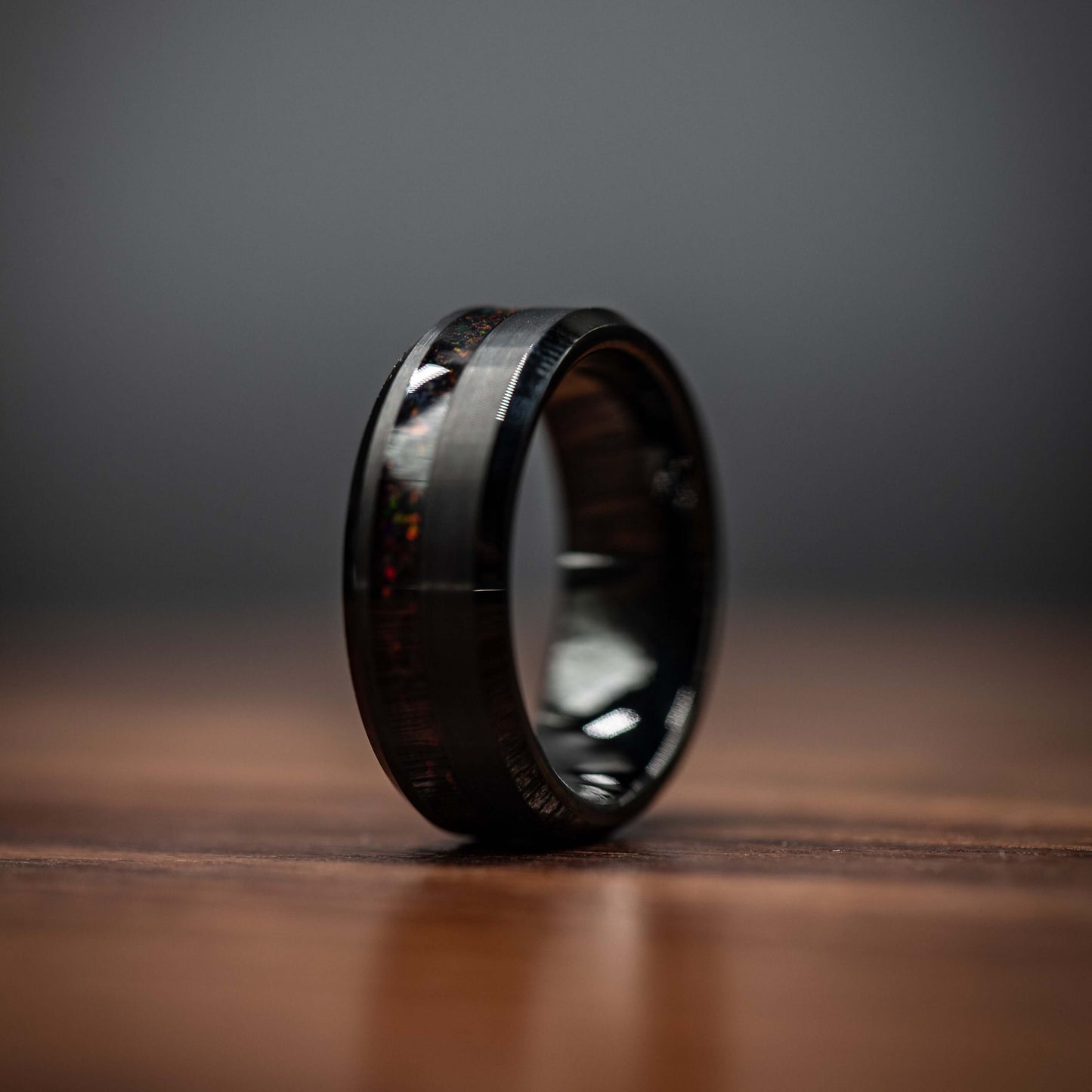 Black brushed tungsten ring featuring a channel of black fire opal, modern 8MM design for men's wedding band.