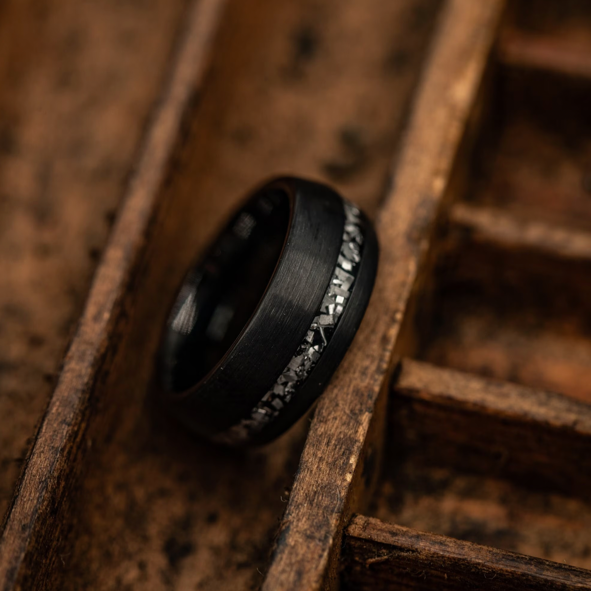 Matching wedding bands for couples featuring genuine meteorite