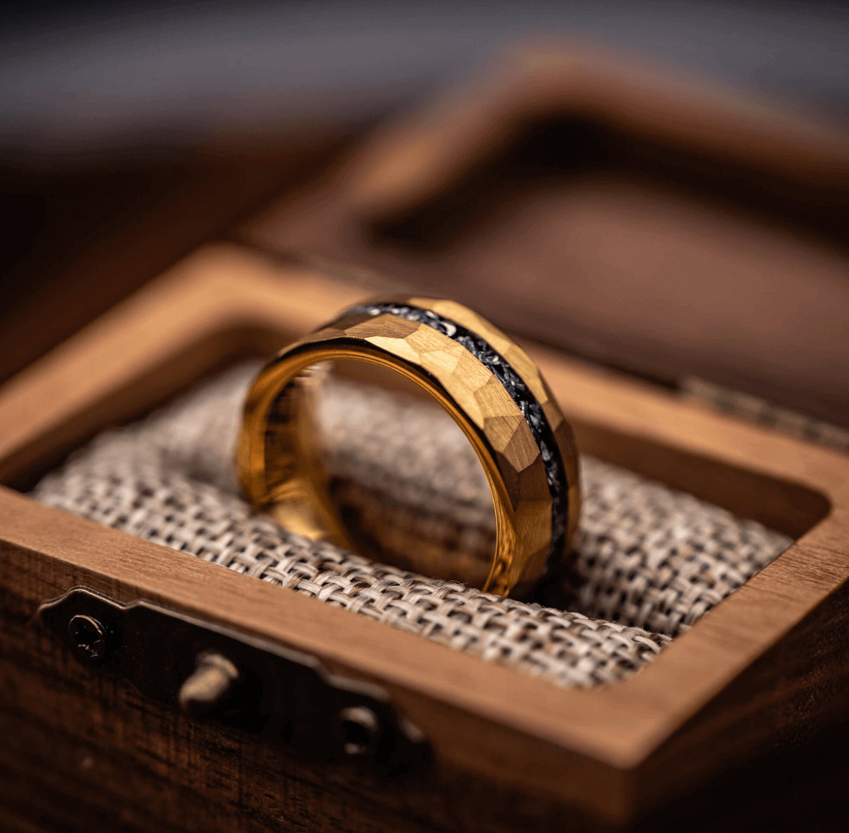 Yellow gold hammered ring with meteorite in ring box