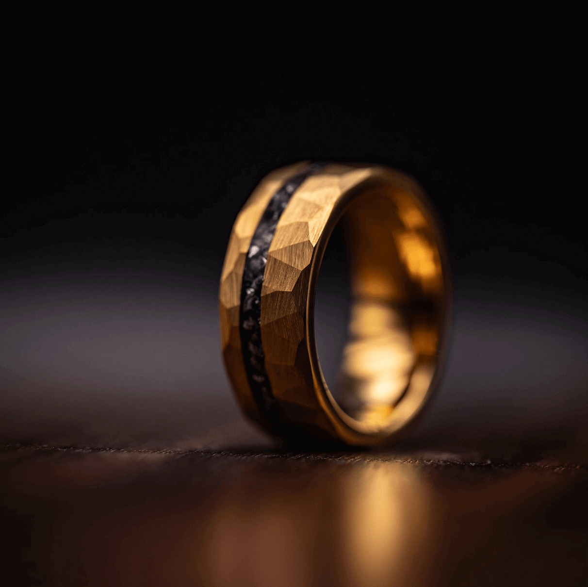 8mm hammered yellow gold ring with meteorite standing on its side