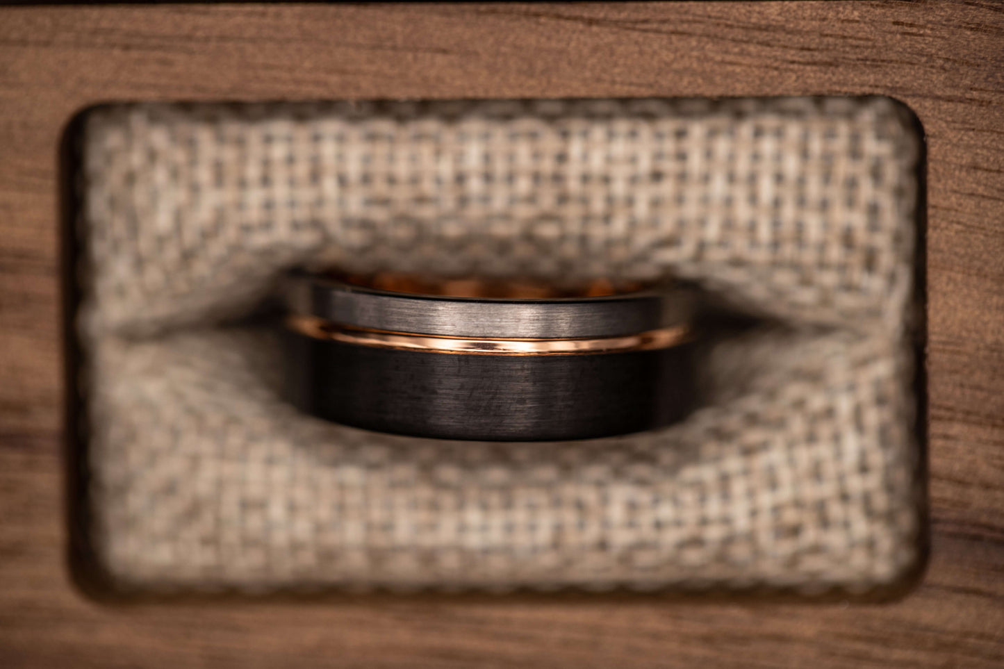 Black and silver wedding ring with rose gold inlay, unique hammered men's engagement band in rustic box