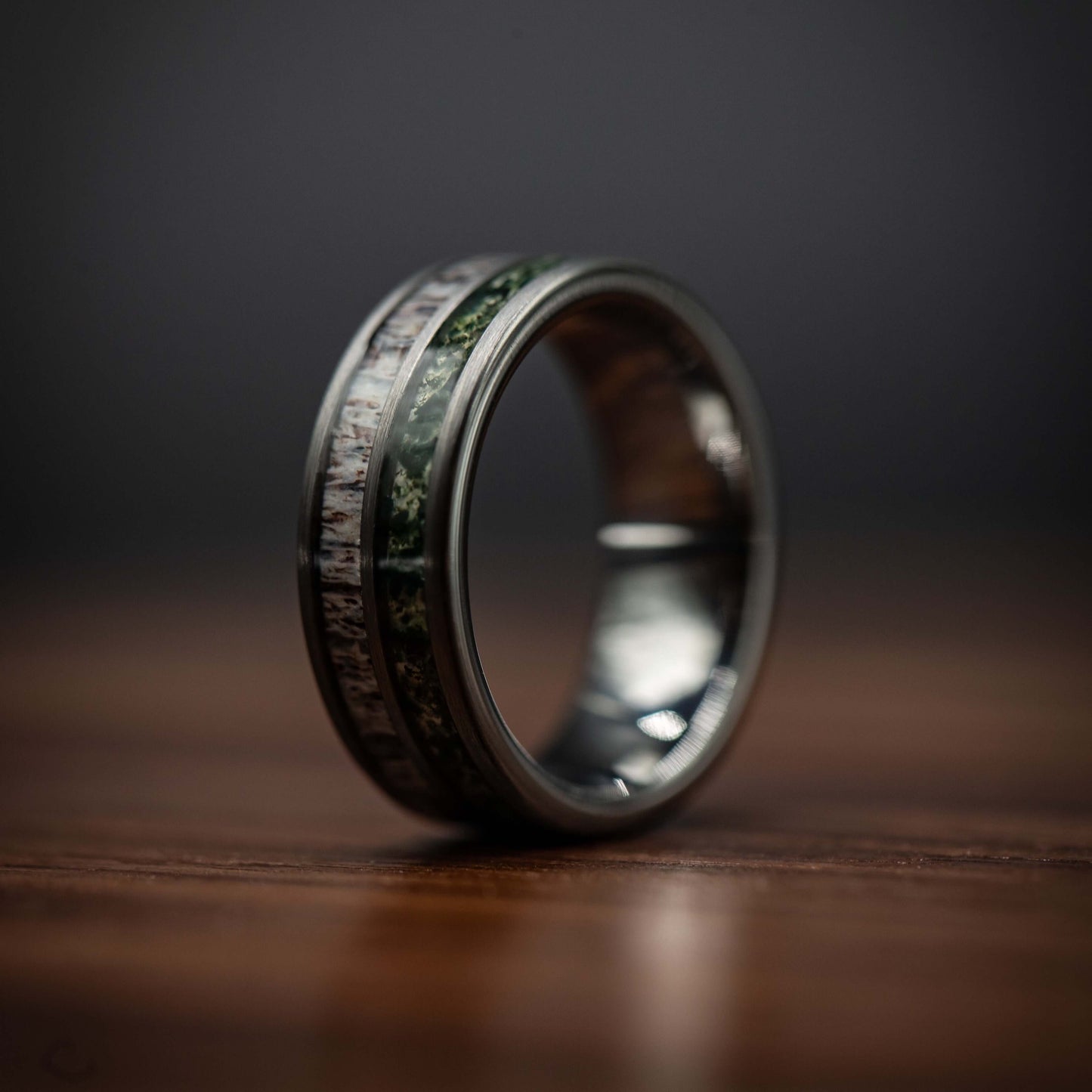 Men's deer antler and moss agate wedding band in polished silver tungsten, 8mm width.