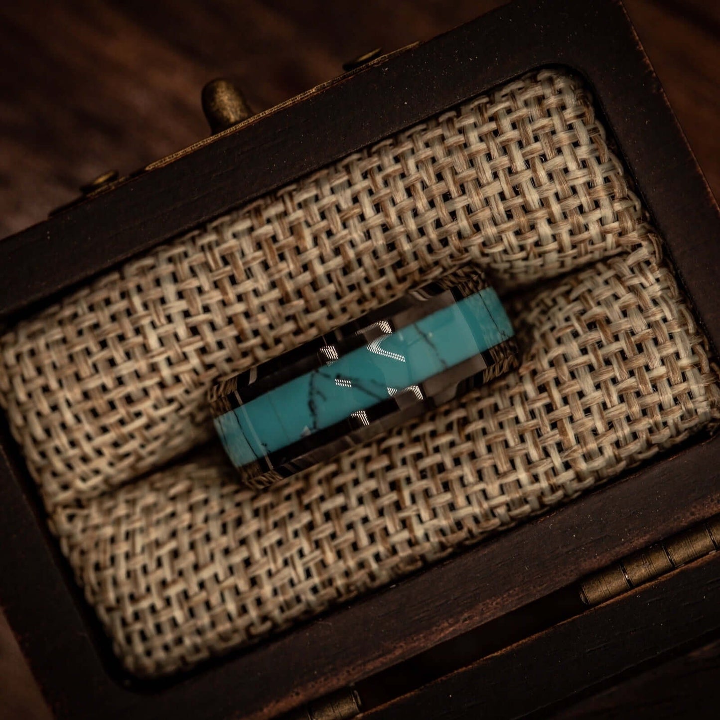Elegant couples wedding bands with striking turquoise and black designs.