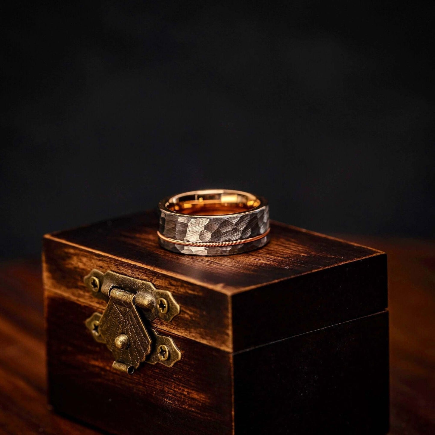 Guitarist's wedding ring crafted with hammered rose gold, silver, and guitar string detail.