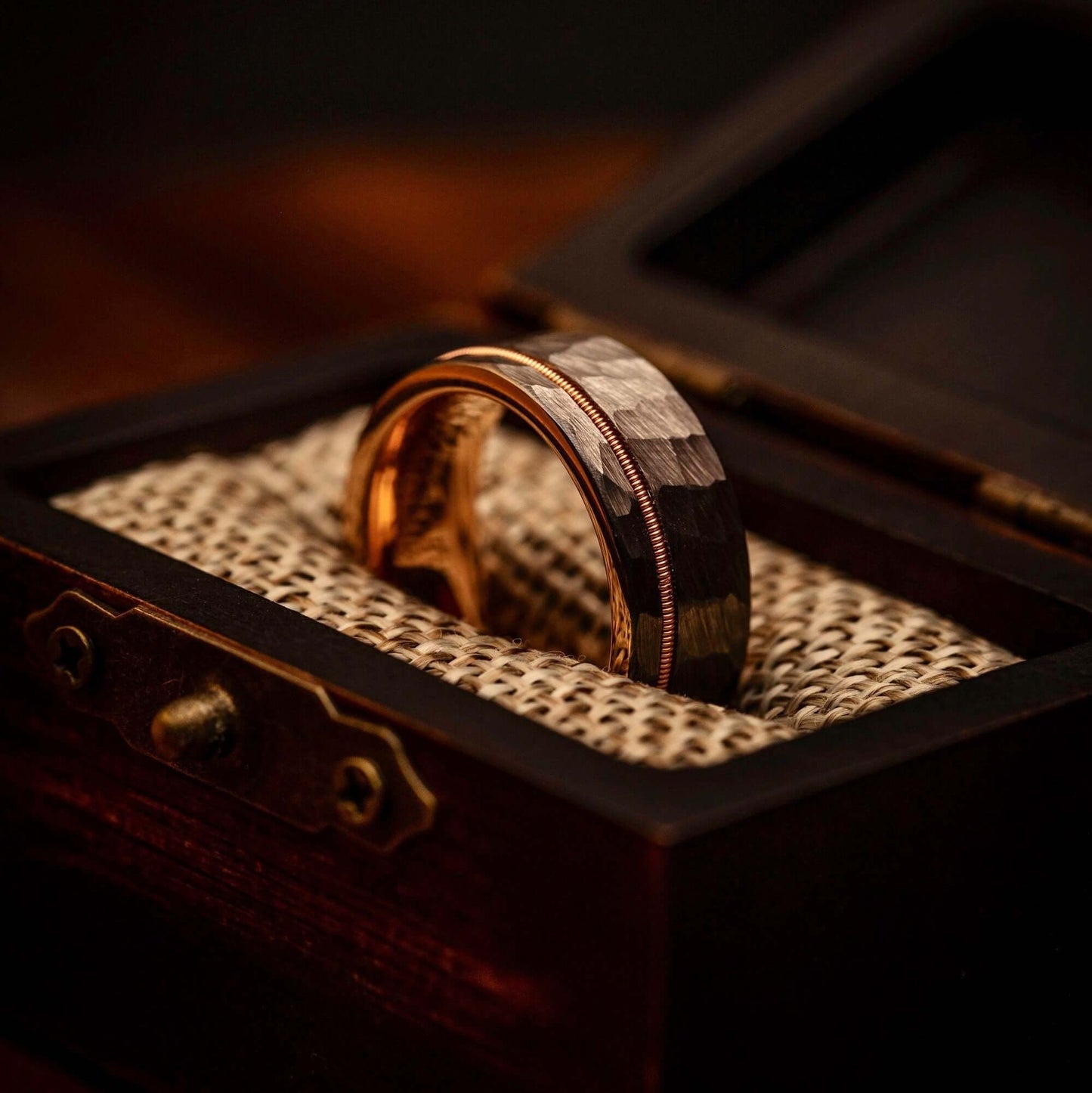Distinctive men's wedding band featuring hammered rose gold, silver, and guitar string accents.