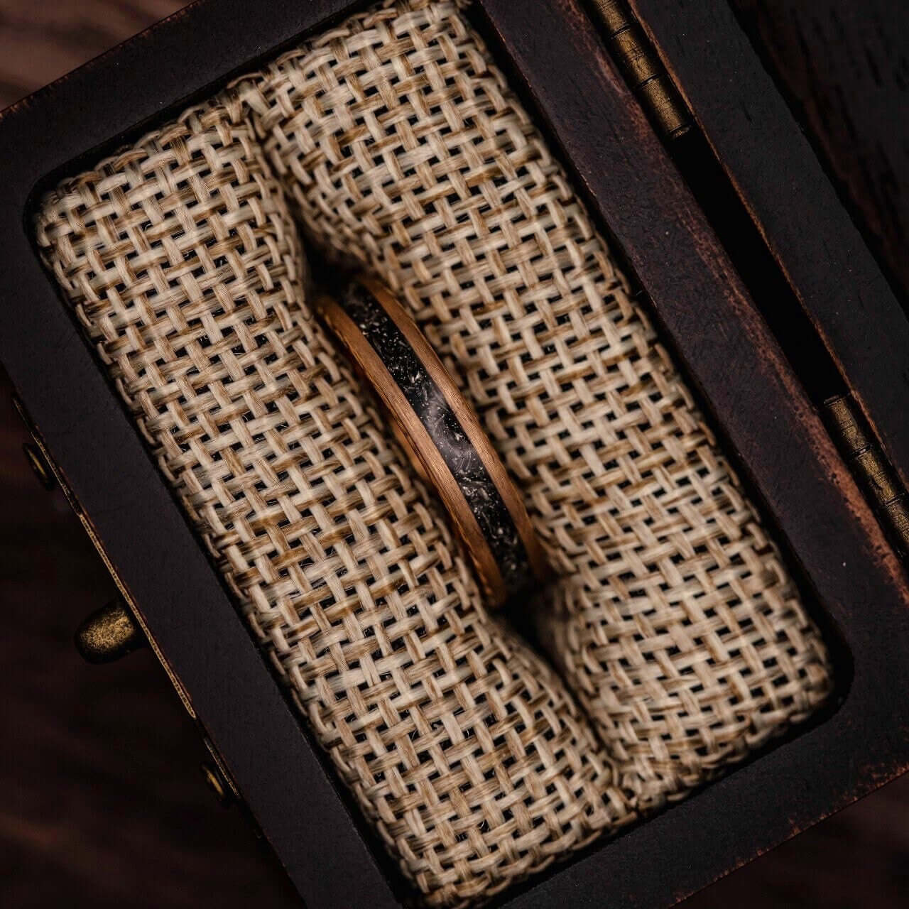 Distinctive wedding ring set featuring matching meteorite bands for couples.