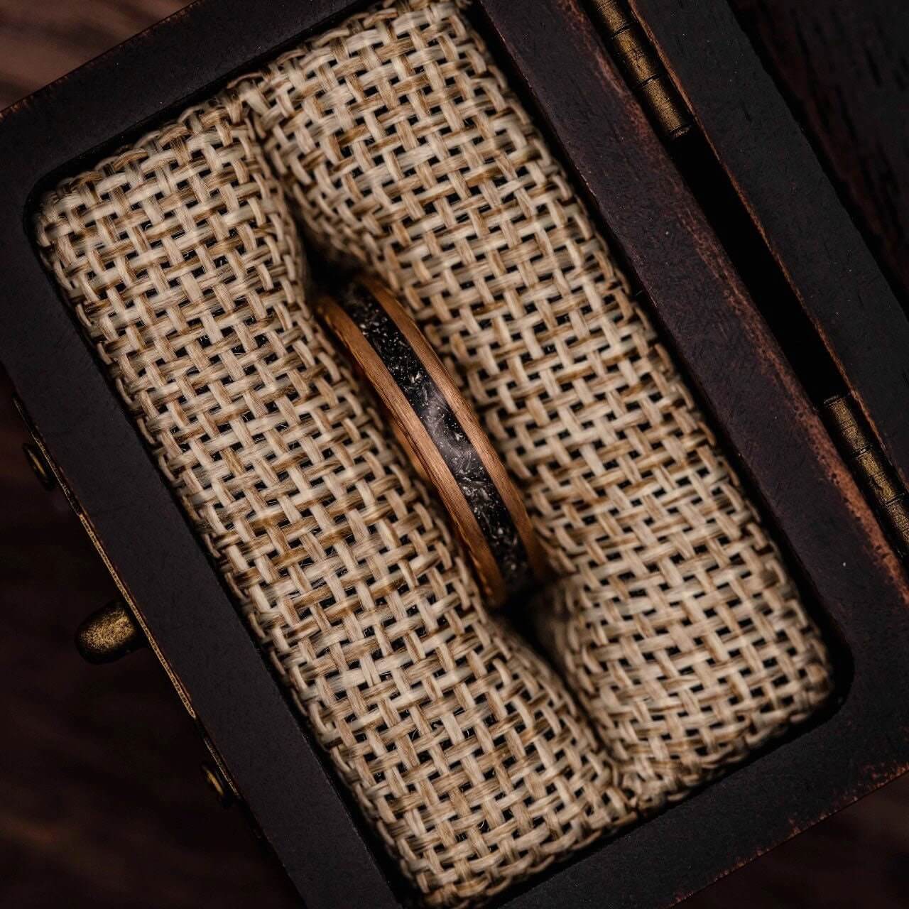 Stylish women's ring crafted from rose gold and real meteorite, ideal for weddings.