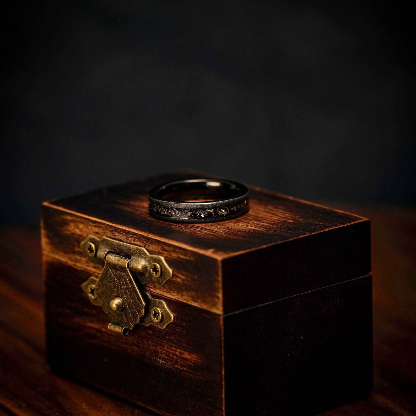 Stunning wedding ring set with black meteorite and sandblasted finish, crafted for couples.