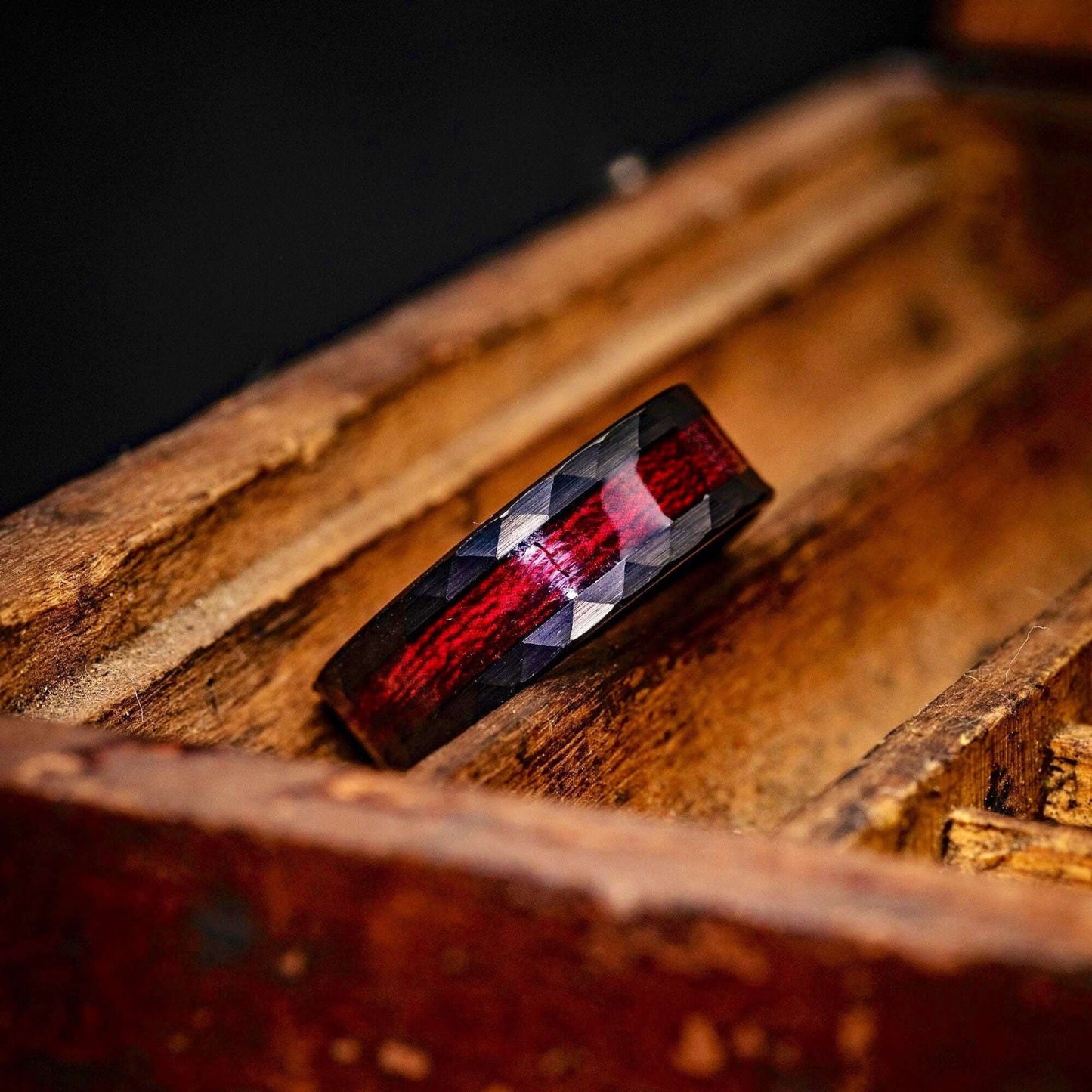 Black 8mm Hammered Wedding ring Set with Red Koa Wood Inlay inside an old wooden box