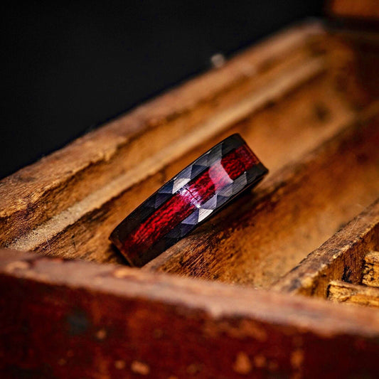 Black 8mm Hammered Wedding ring Set with Red Koa Wood Inlay inside an old wooden box