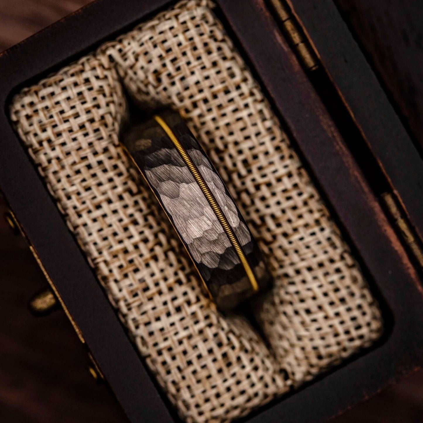 Handsome men's wedding band with silver and gold detailing, symbolizing everlasting love.