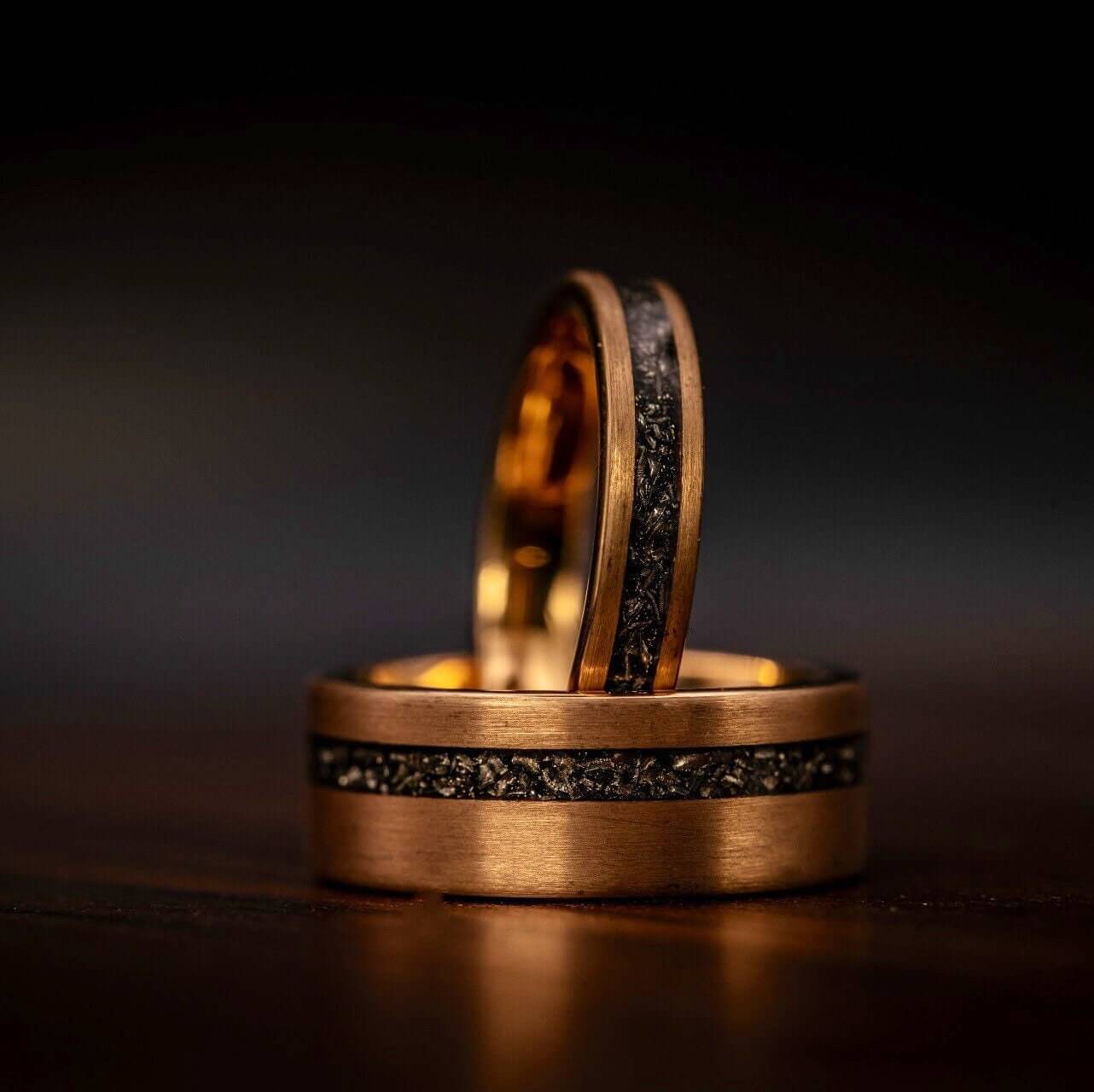 Striking rose gold ring with meteorite inlay, an exquisite choice for weddings.