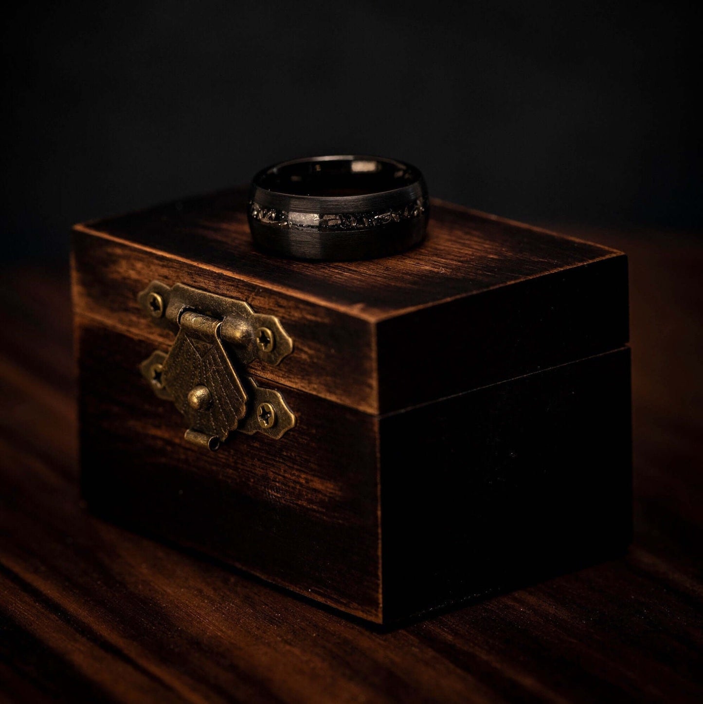 Bold 8mm men's wedding band crafted from brushed black meteorite.