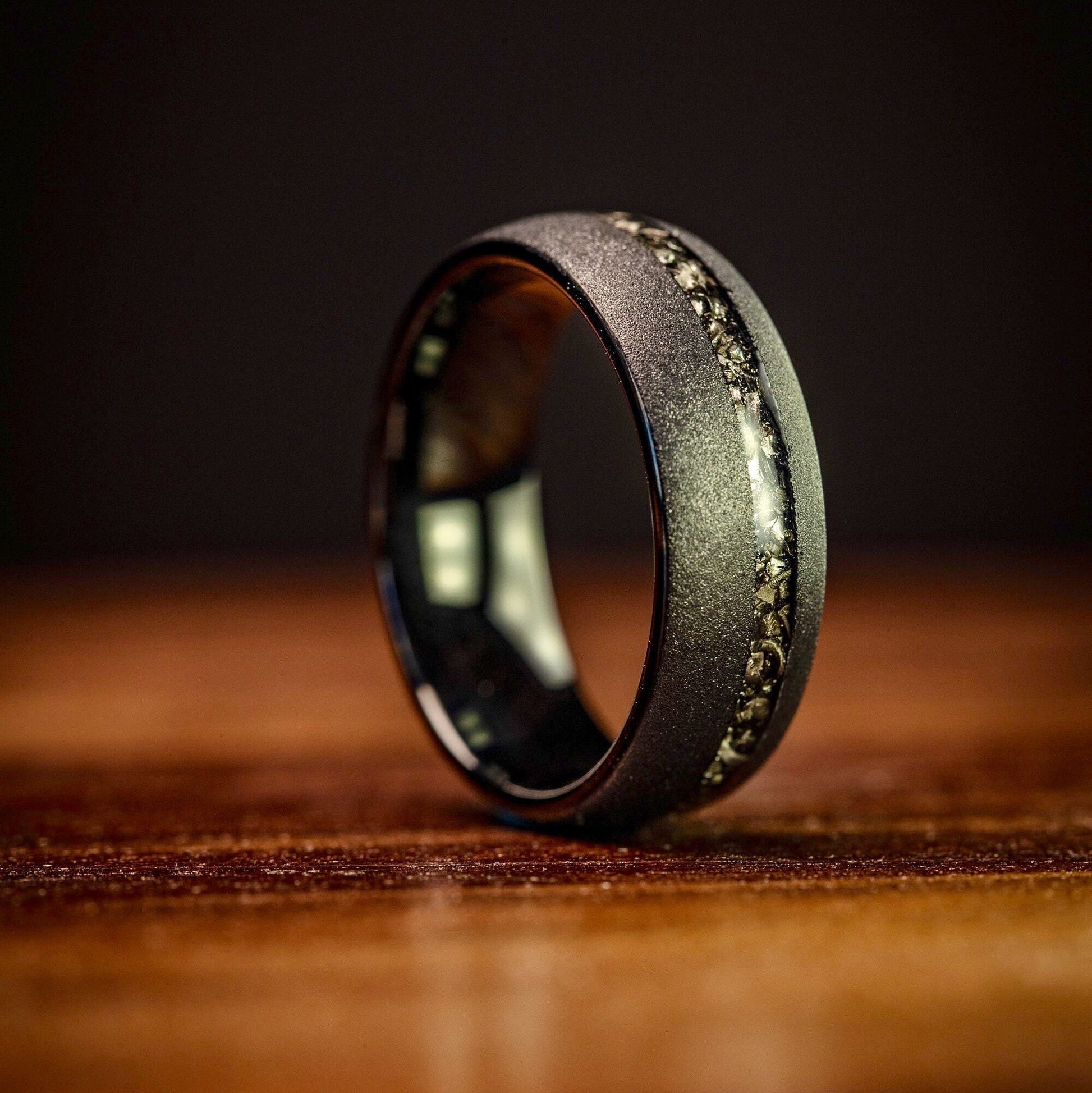 Matching couples black meteorite wedding rings, perfect for exchanging vows.