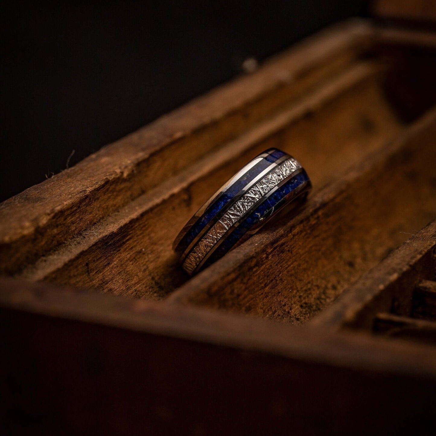 Handsome silver wedding ring adorned with blue lapis lazuli and authentic meteorite.