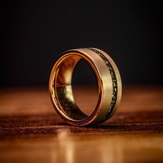 Men's rose gold wedding band with real meteorite inlay, a celestial touch for weddings.