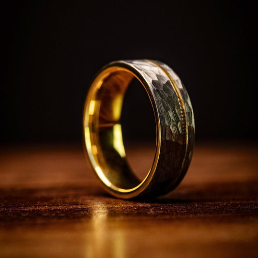 Men's wedding band featuring a blend of silver and gold, with a distinctive guitar string design.