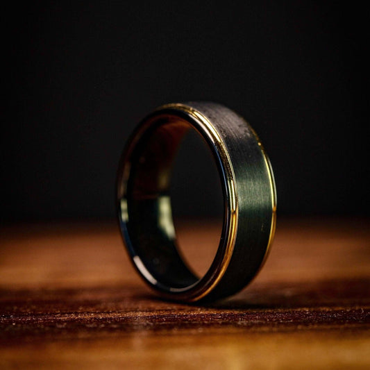 Black tungsten wedding ring with 18k Yellow Gold Step edges