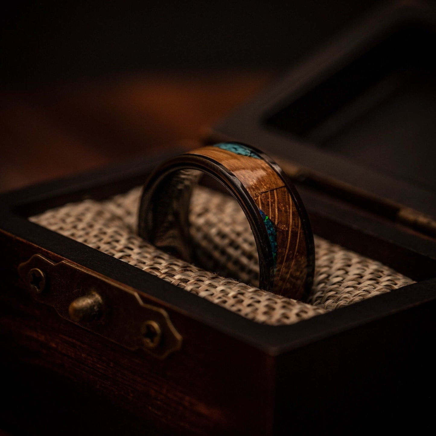 Tungsten wedding ring with wood inlay paired with turquoise and blue opal throughout