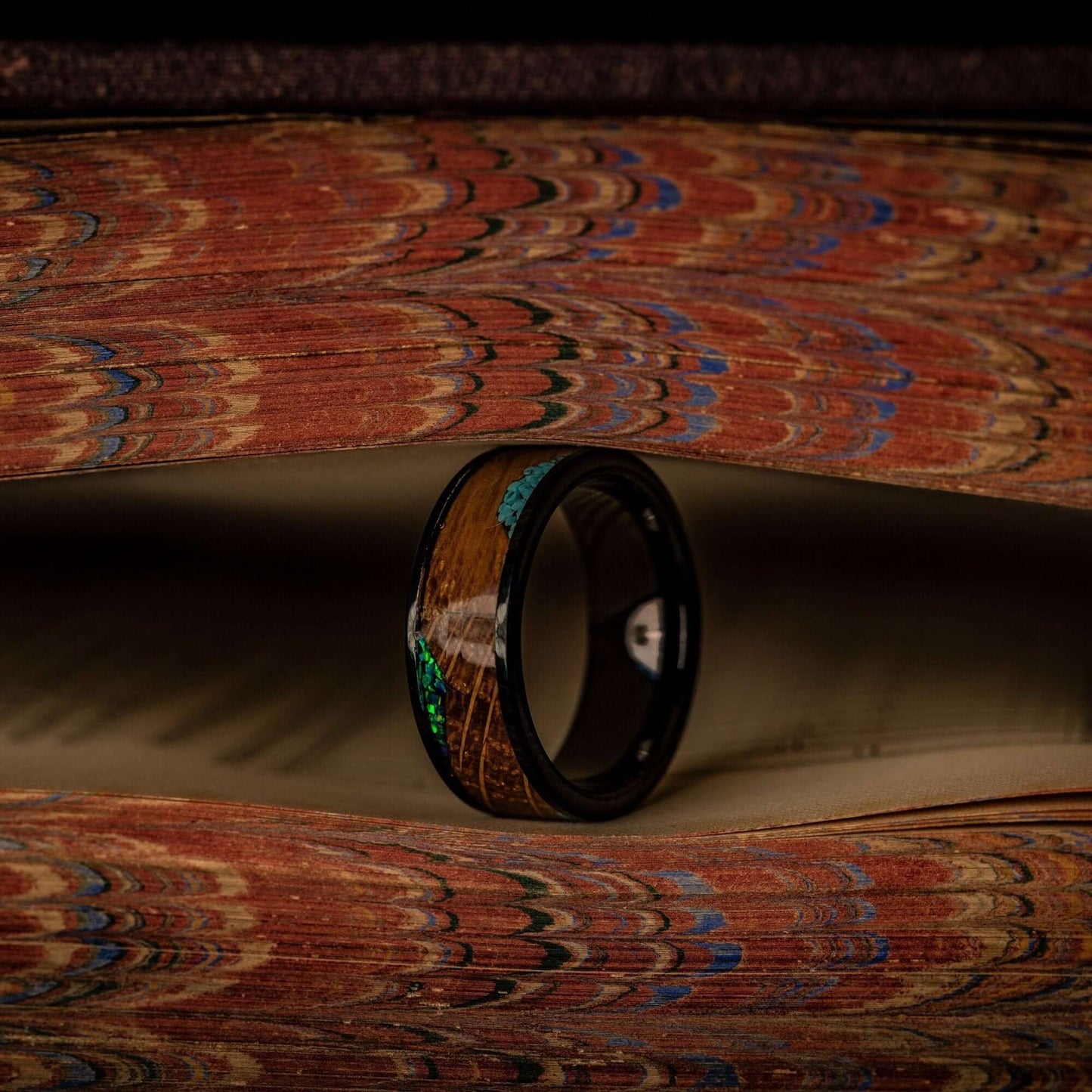 Whiskey Barrel wood wedding ring with turquoise and opal throughout the inlay