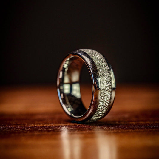 Unique men's meteorite ring with silver band, perfect for weddings or engagements.