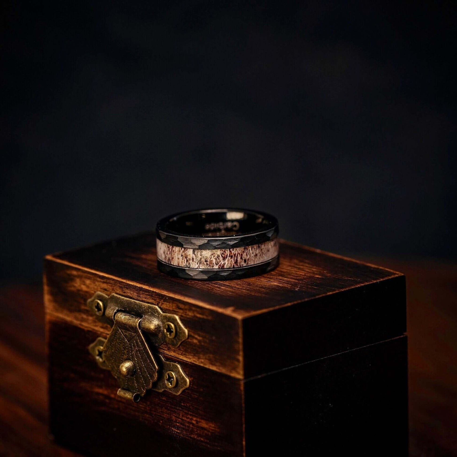 Handsome men's engagement ring crafted with black finish and real antler.