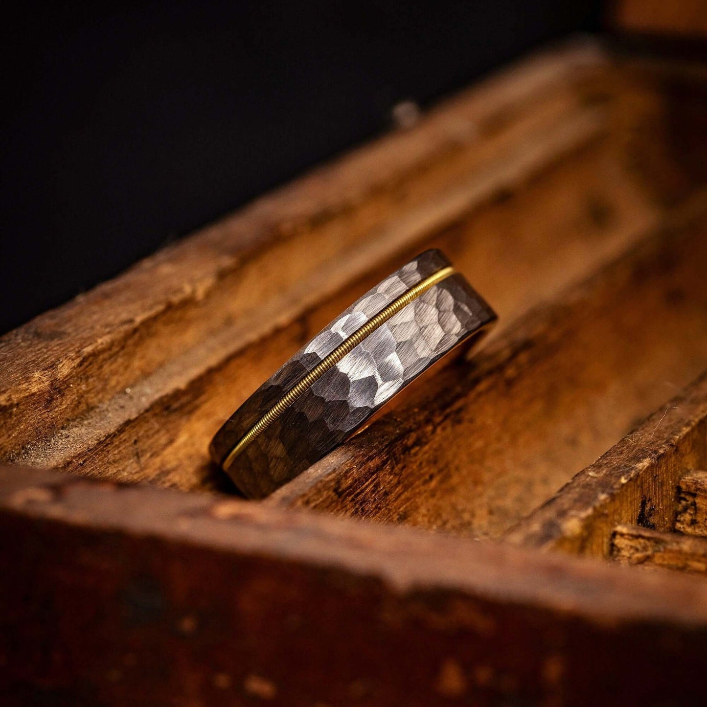 Elegant men's wedding band crafted with silver and gold, offering timeless sophistication.