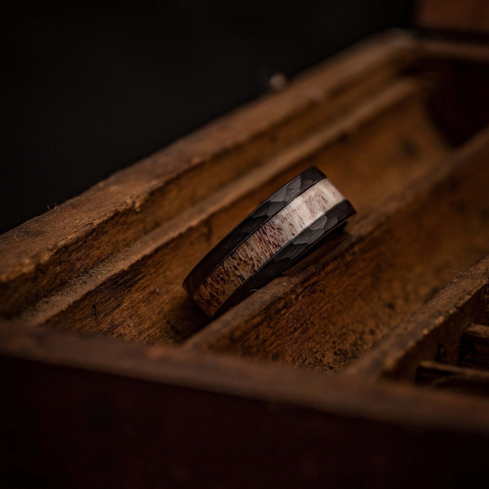Unique men's wedding band with hammered texture and genuine deer antler.