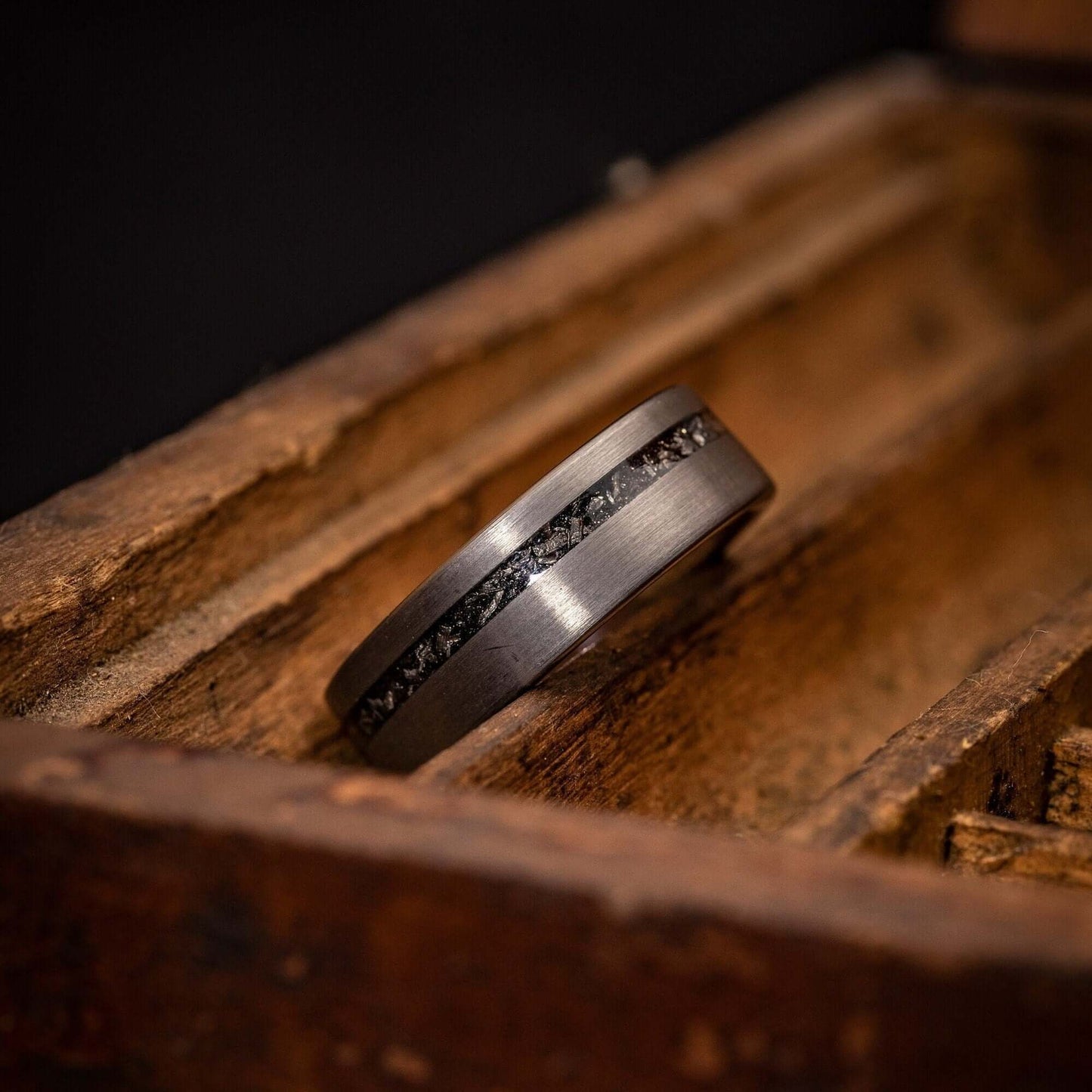 Elegant men's wedding band featuring authentic meteorite, perfect for engagements.