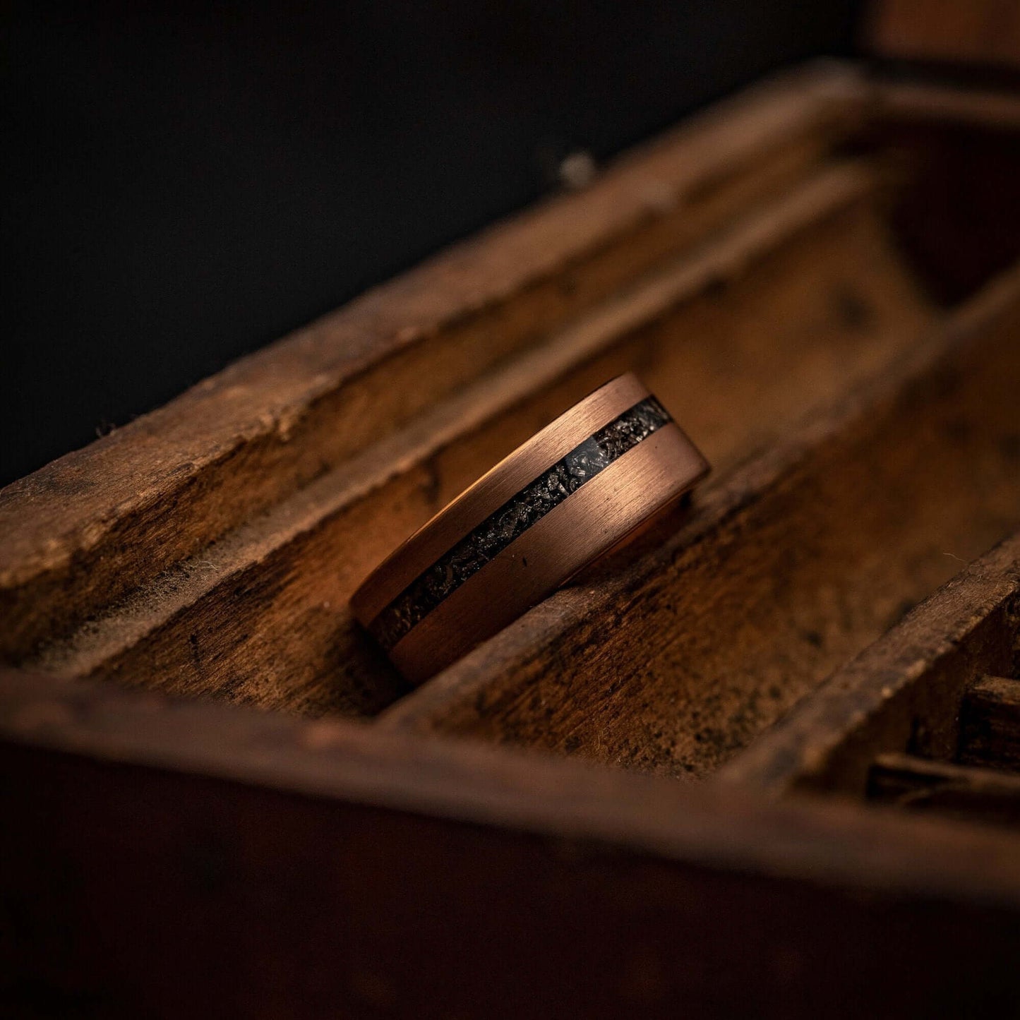 Unique his and hers wedding rings with genuine meteorite and rose gold accents.