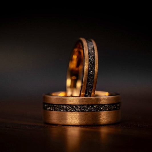 Matching couples meteorite wedding rings, symbolizing eternal love and commitment.