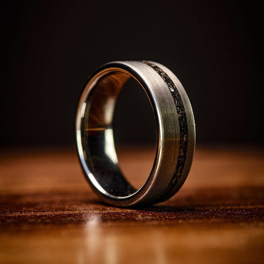 Men's tungsten band with real meteorite inlay, a striking choice for weddings.
