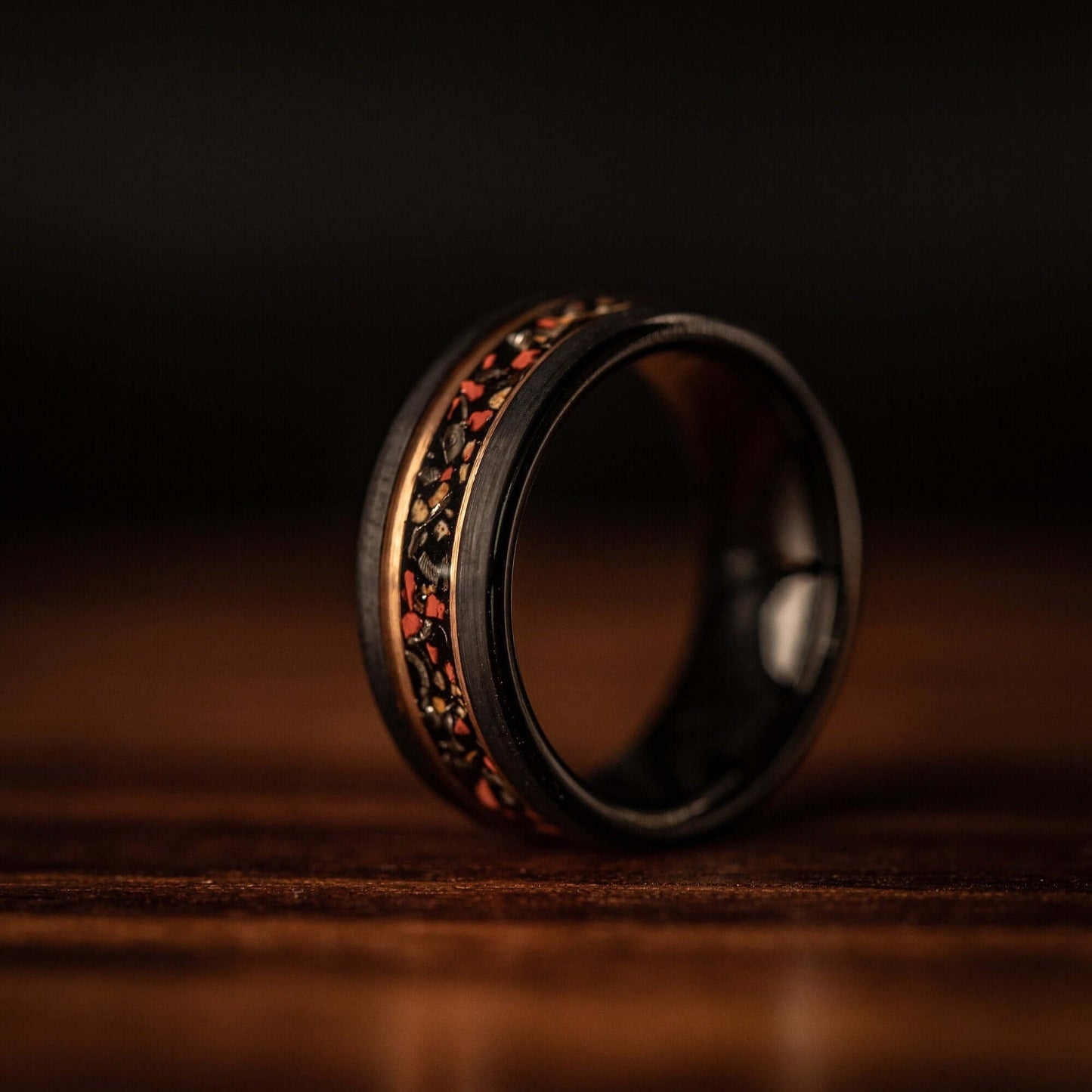 Black wedding Ring with Meteorite and Red Dinosaur Bone inlay