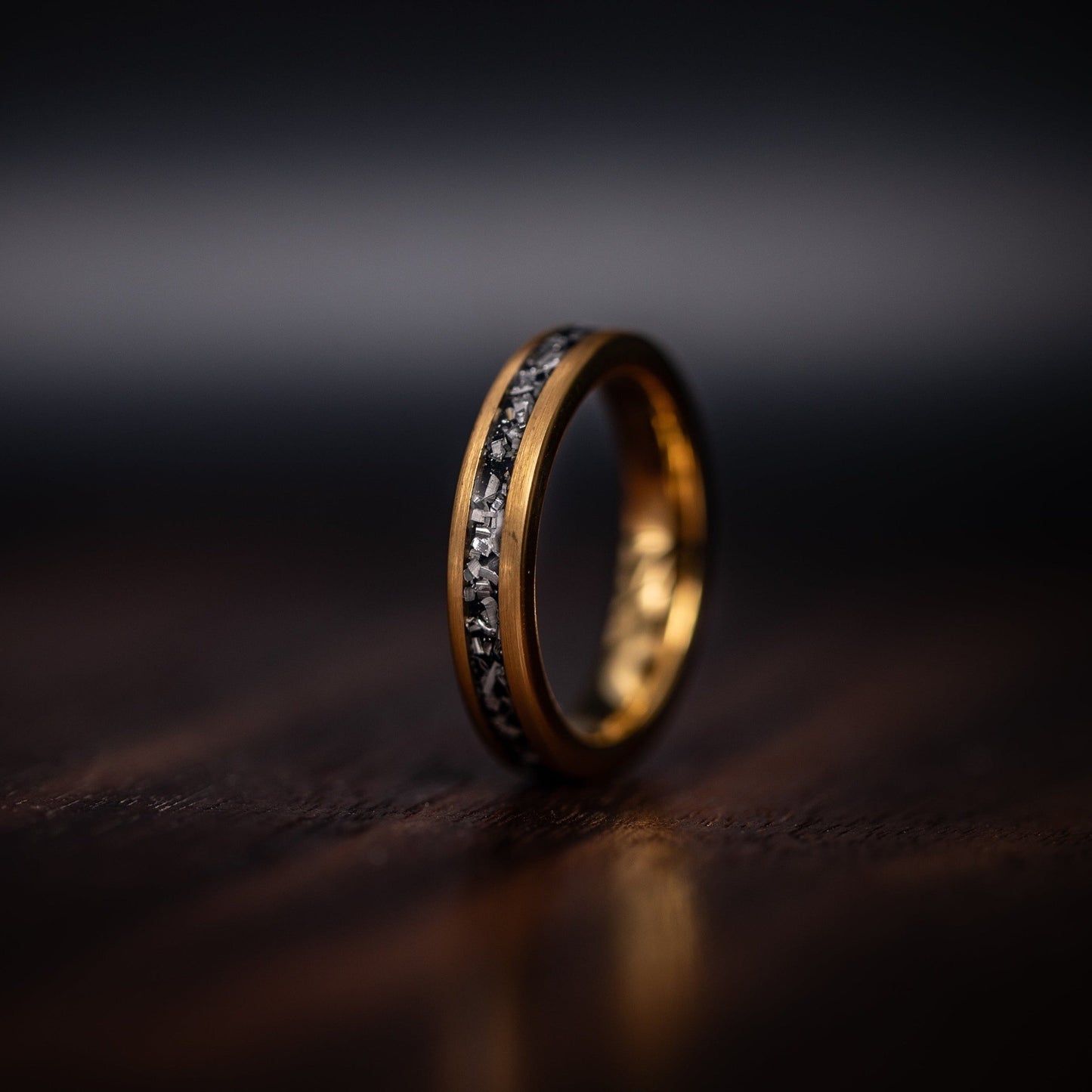 Women's yellow gold meteorite ring standing on edge