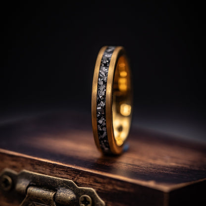 Unique his and hers wedding rings with genuine meteorite and yellow gold accents.