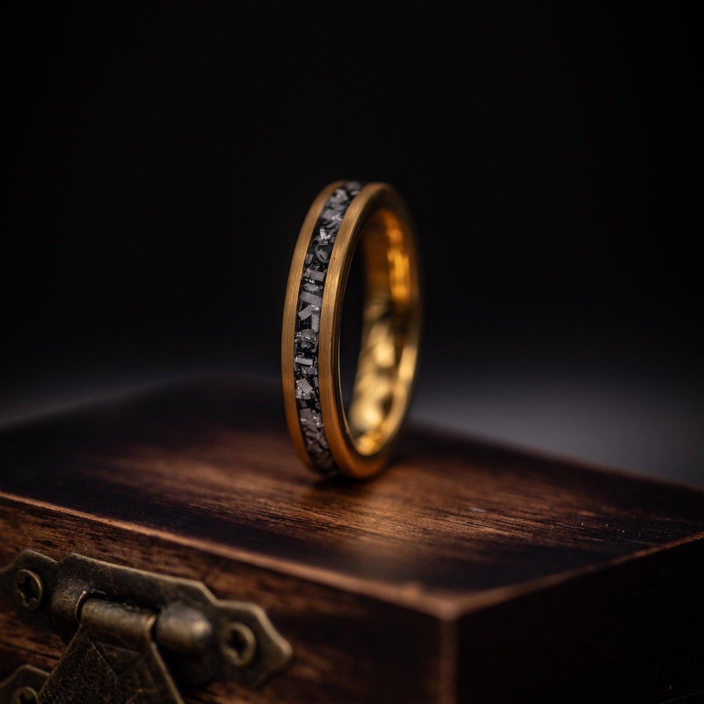 WOmen's Yellow gold ring standing on top of ring box