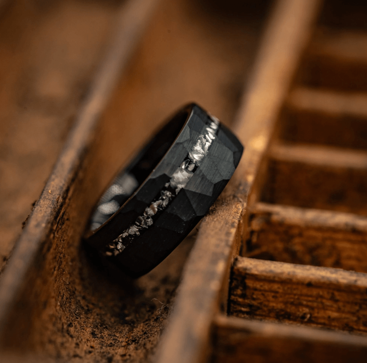 Unique black meteorite ring for men, showcasing an 8mm width and hammered texture.