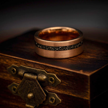 Sophisticated meteorite wedding band for men, complemented by rose gold accents.