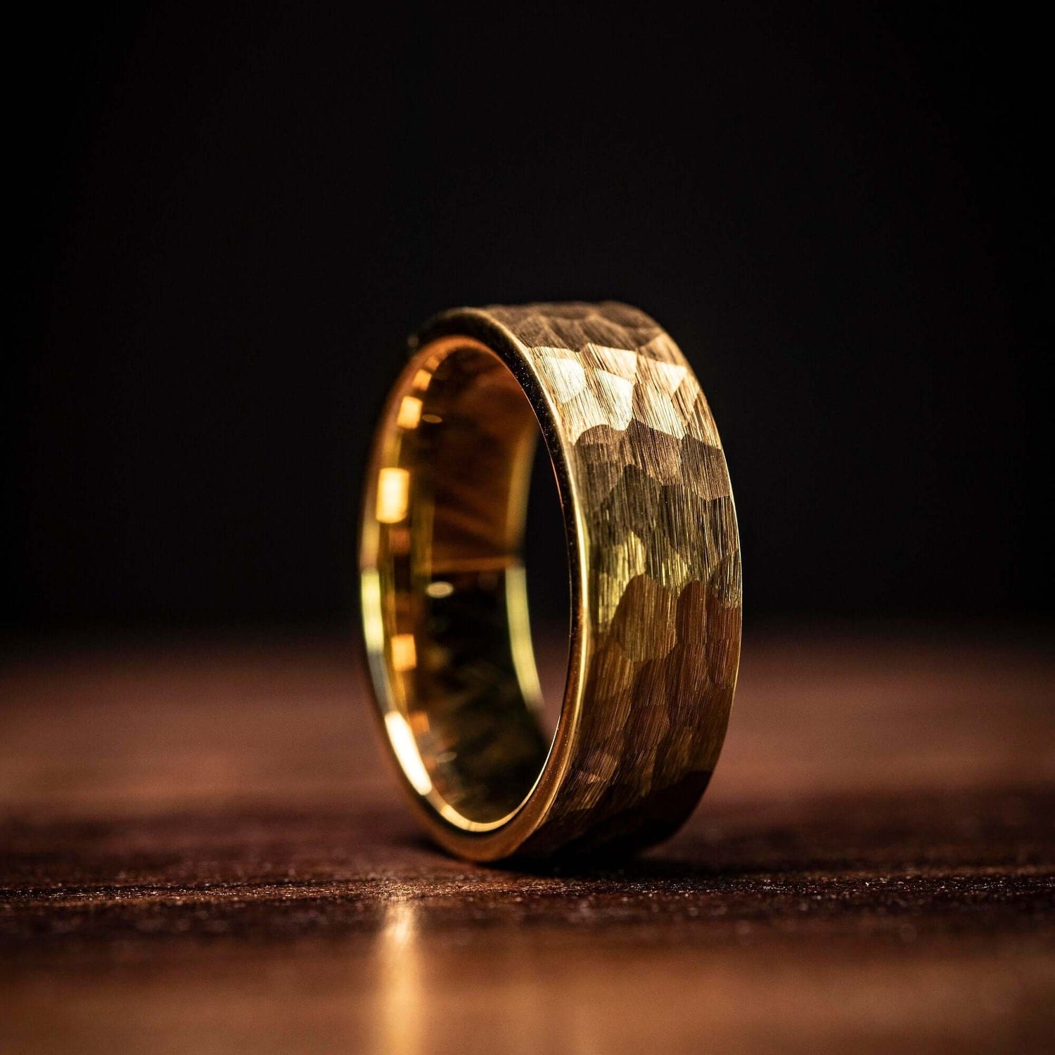 Sophisticated gold tungsten wedding ring with hammered detailing, symbolizing eternal love.