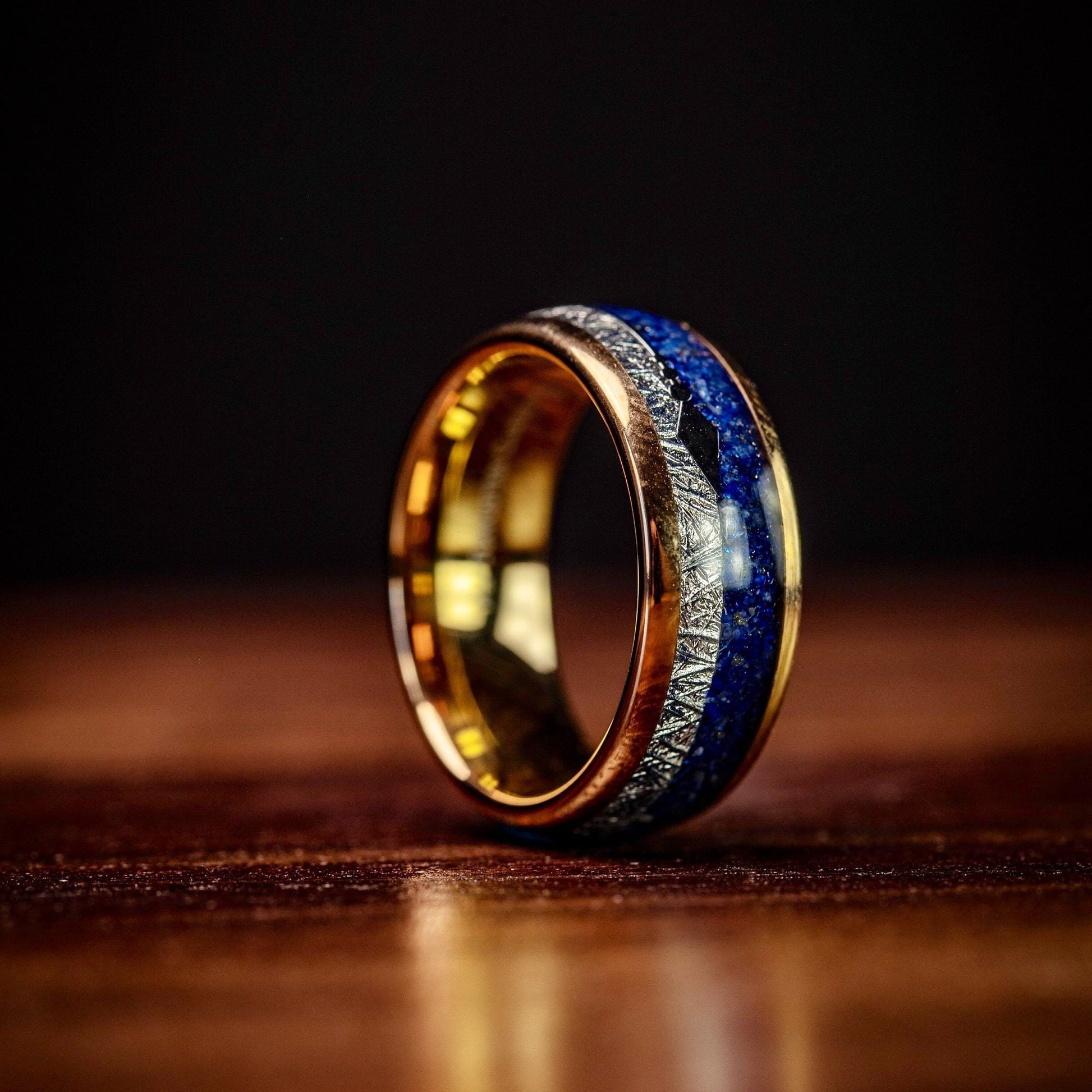 Unique rose gold wedding ring featuring lapis lazuli and meteorite accents.