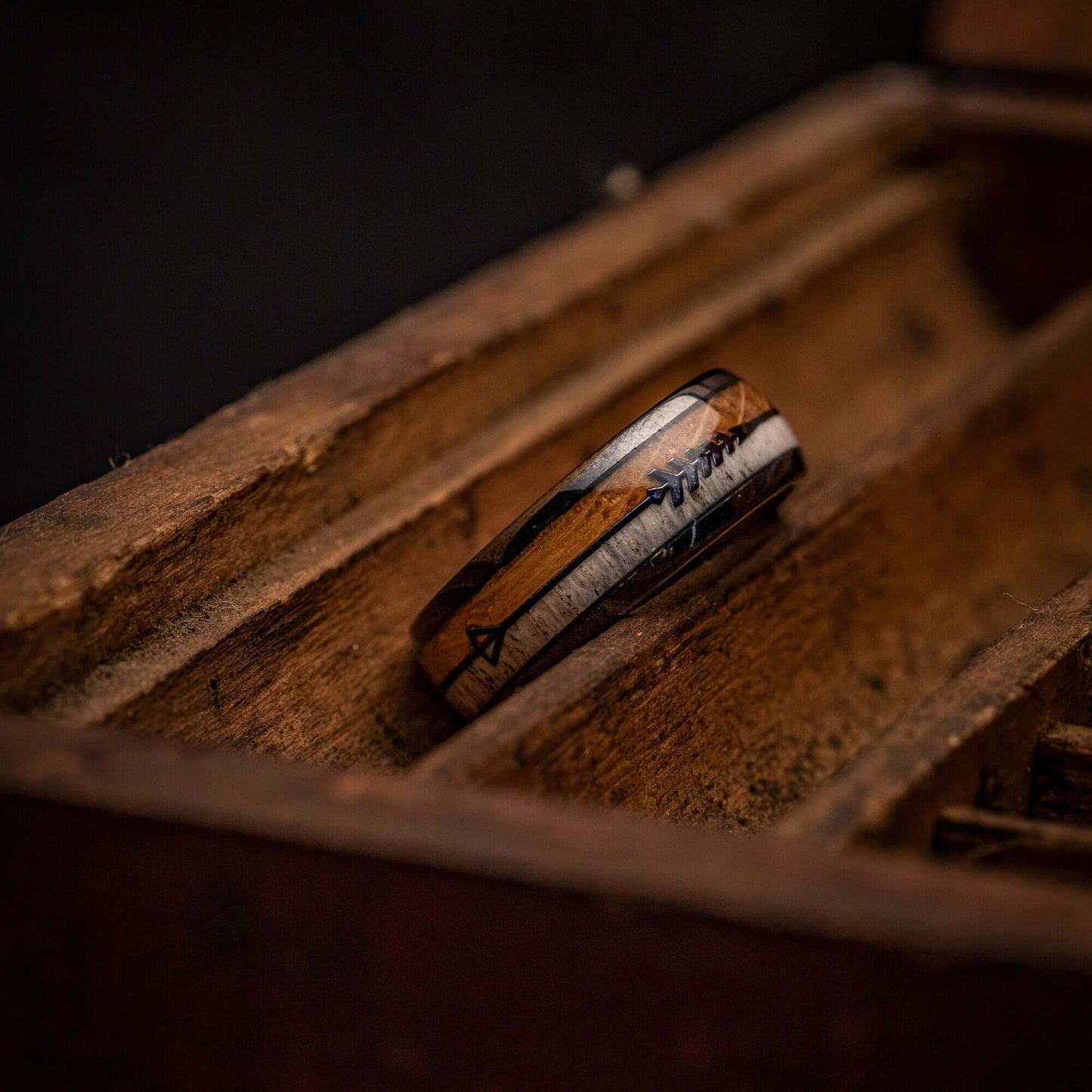 Men's 8mm Tungsten wedding Ring with Whiskey Barrel Wood and Deer Antler inlay inside a wooden box