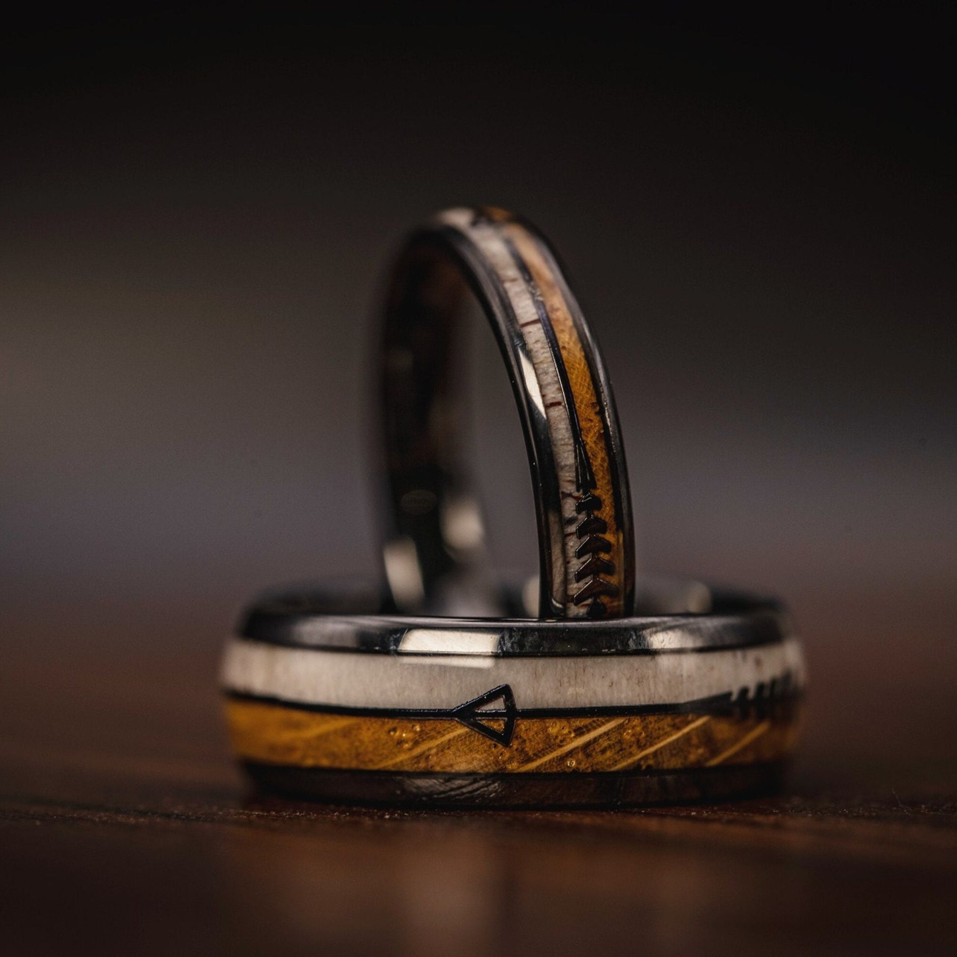Rustic wedding band crafted from genuine deer antler and whiskey barrel wood.