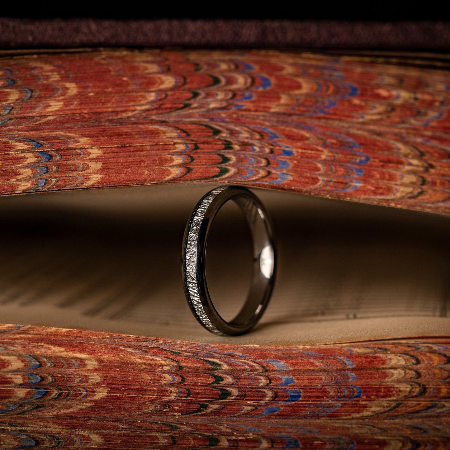Elegant meteorite wedding ring for women, showcasing genuine meteorite detailing.