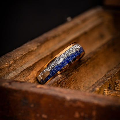 Elegant wedding band crafted from rose gold with lapis lazuli and meteorite elements.