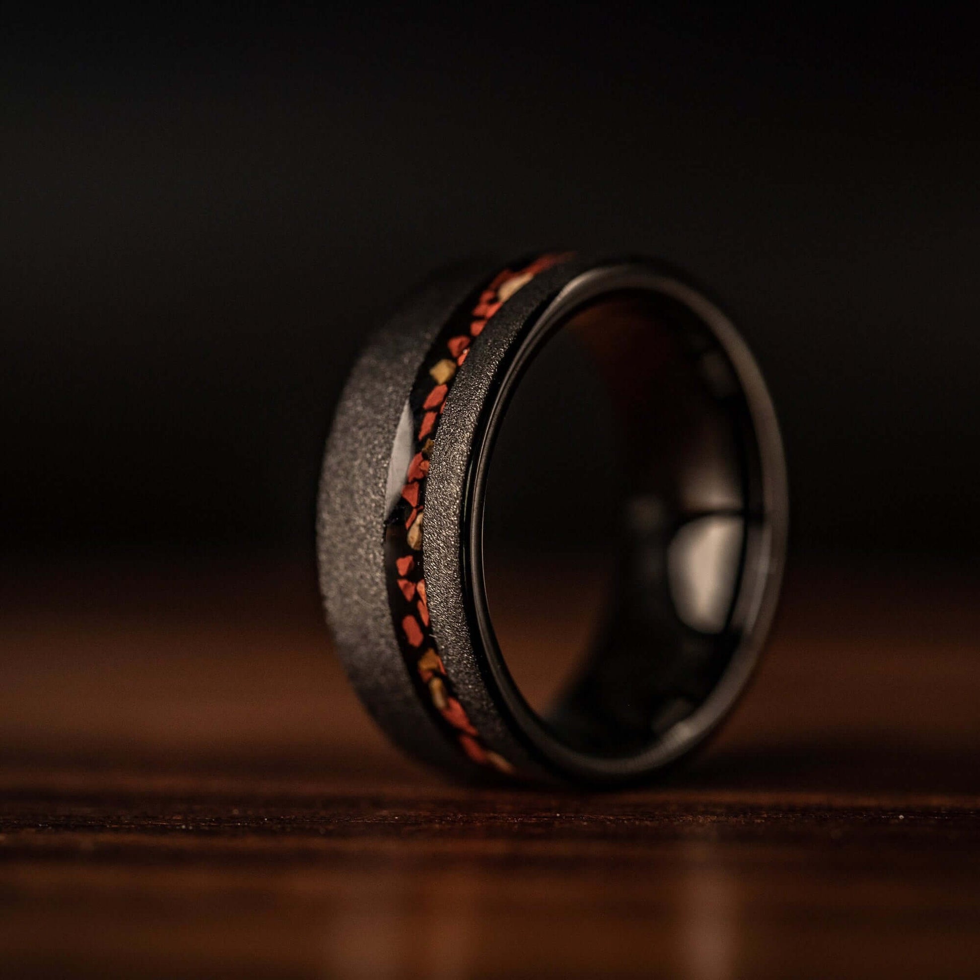 Tungsten wedding band with eye-catching dinosaur bone inlay, perfect for dinosaur enthusiasts.